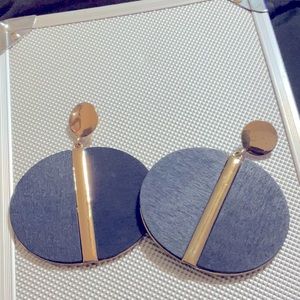 Gold and navy blue wood and metal earrings.